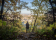 woman in trees over city